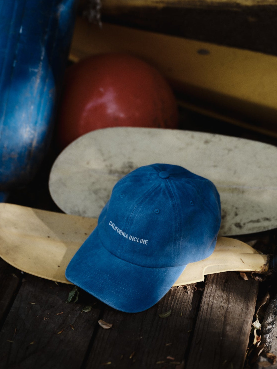 Blue cap on a wooden surface with a blurred background